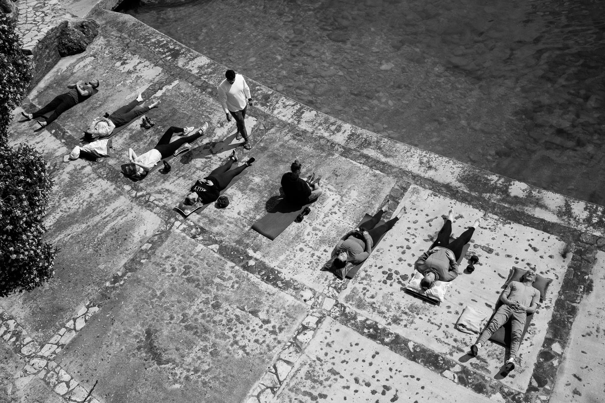 Black-and-white overhead of the group on the terrace.